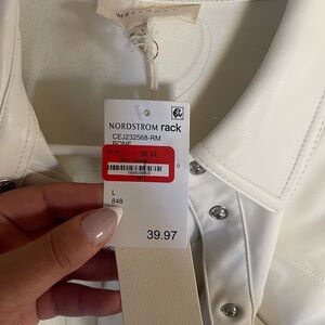Never been worn, cream faux leather bottom down top